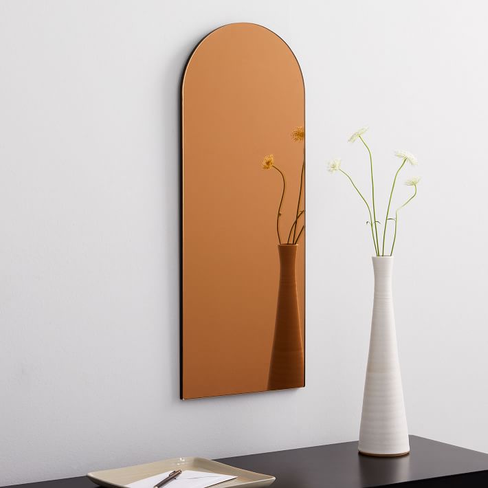 Frameless wall mounted mirror
